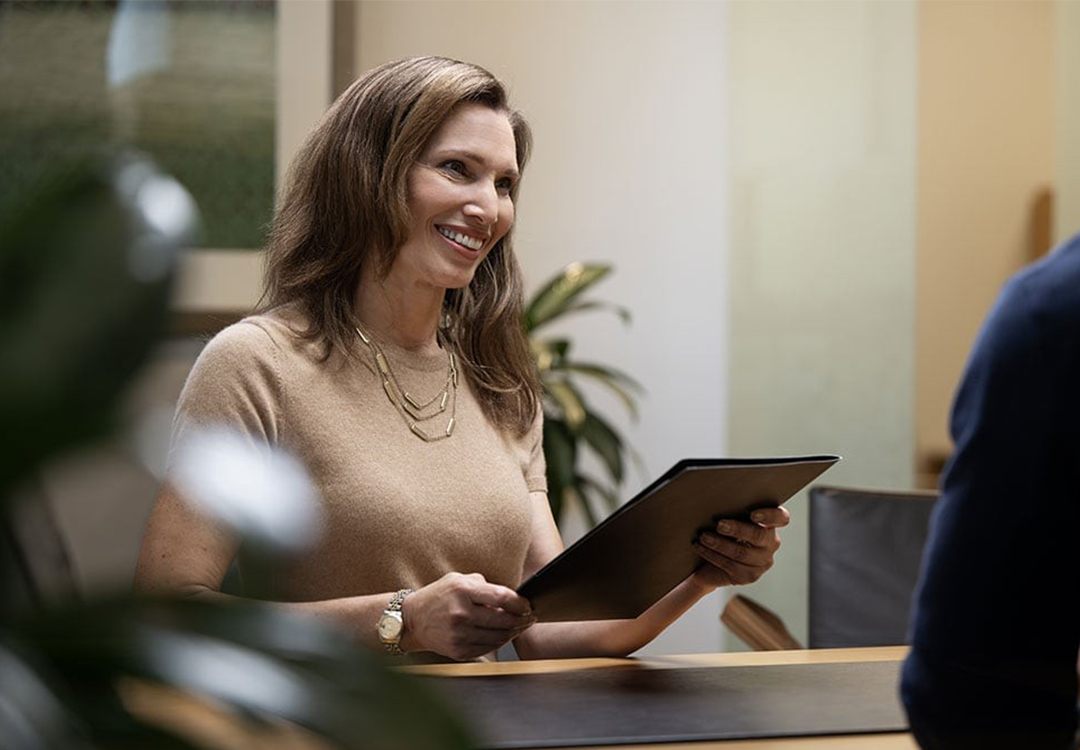 A woman holding a clipboard