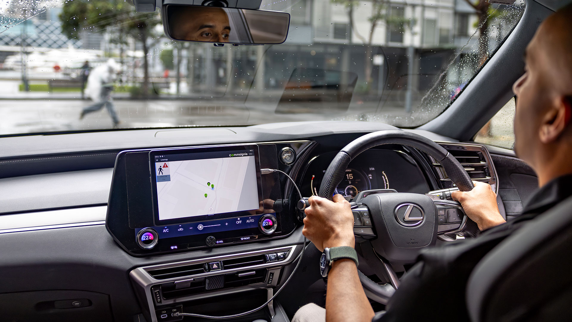 Infrastructure-to-vehicle C-ITS technology sends Lexus vehicle visual alert for pedestrian approaching from out of view. All images indicative only